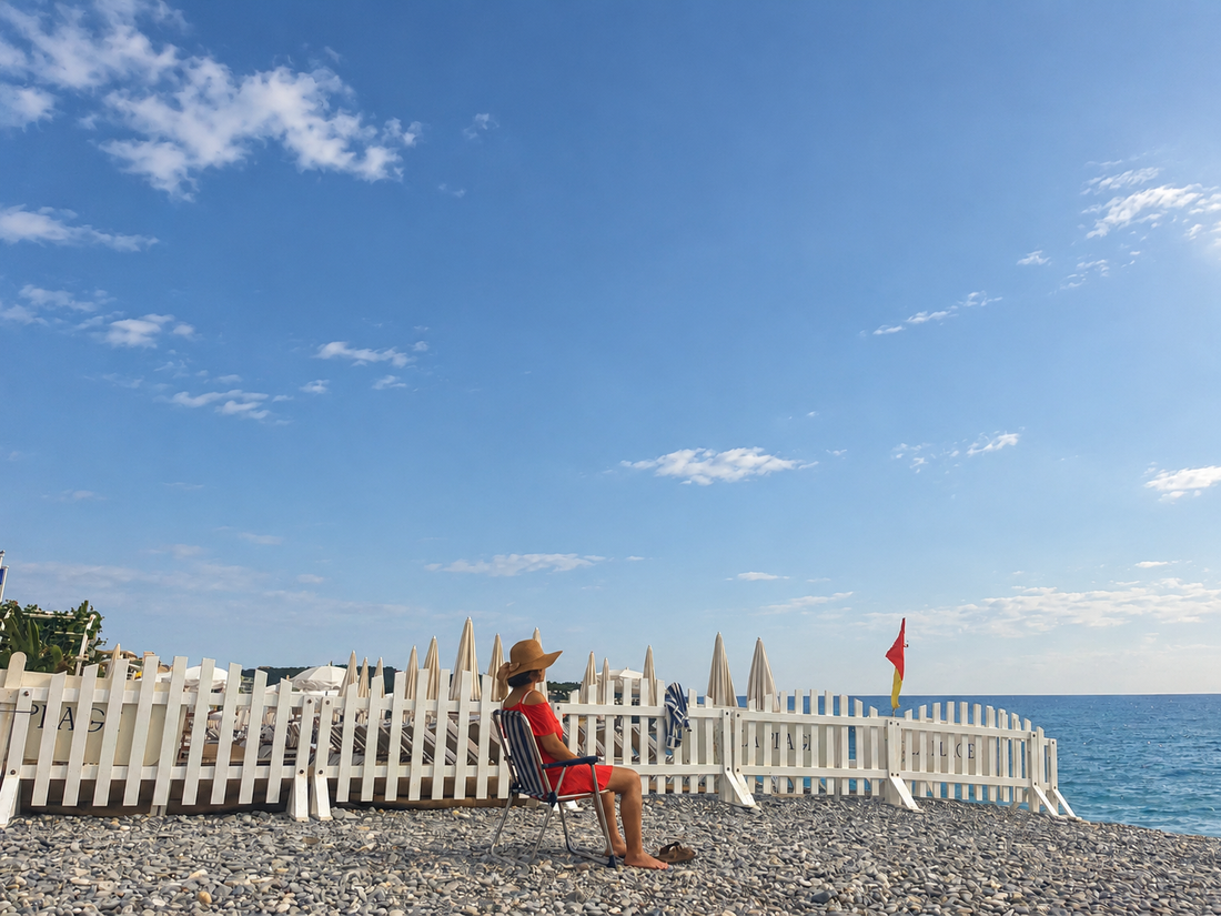 Lady meditating on the beach while travelling alone