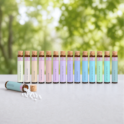 The 14 Nomad Secrets vials laid out from the S.O.S. Travel Companion pocket collection